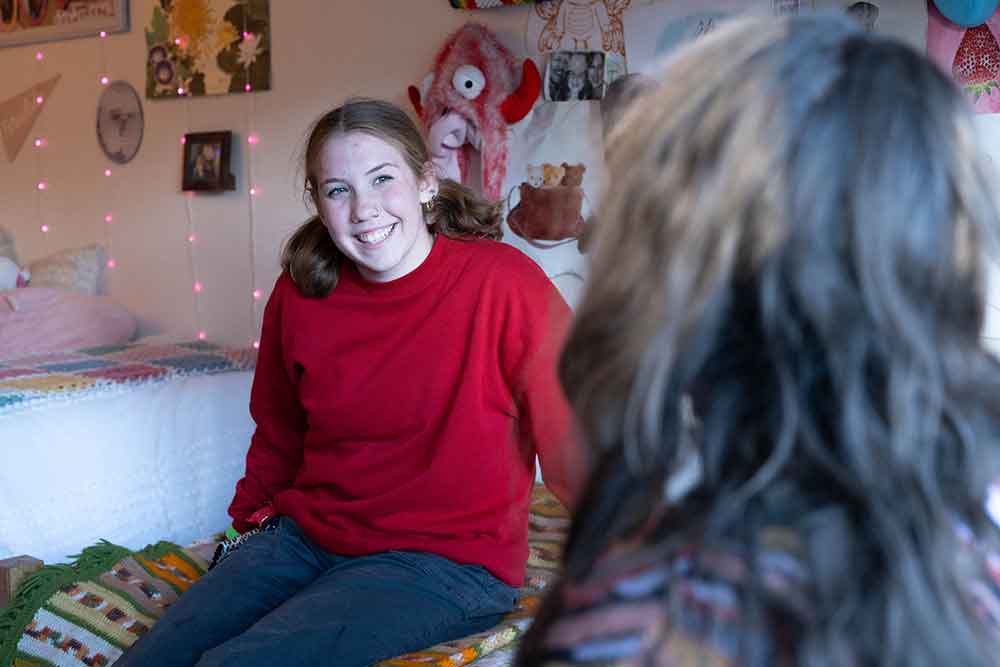 Western Oregon University student inside a residence hall room